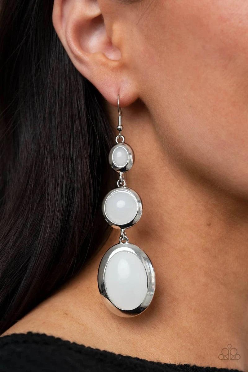 Paparazzi Accessories Retro Reality - White Featuring cloudy finishes, mismatched glassy white beads are encased in sleek silver frames that whimsically link into a colorfully retro lure. Earring attaches to a standard fishhook fitting. Sold as one pair o