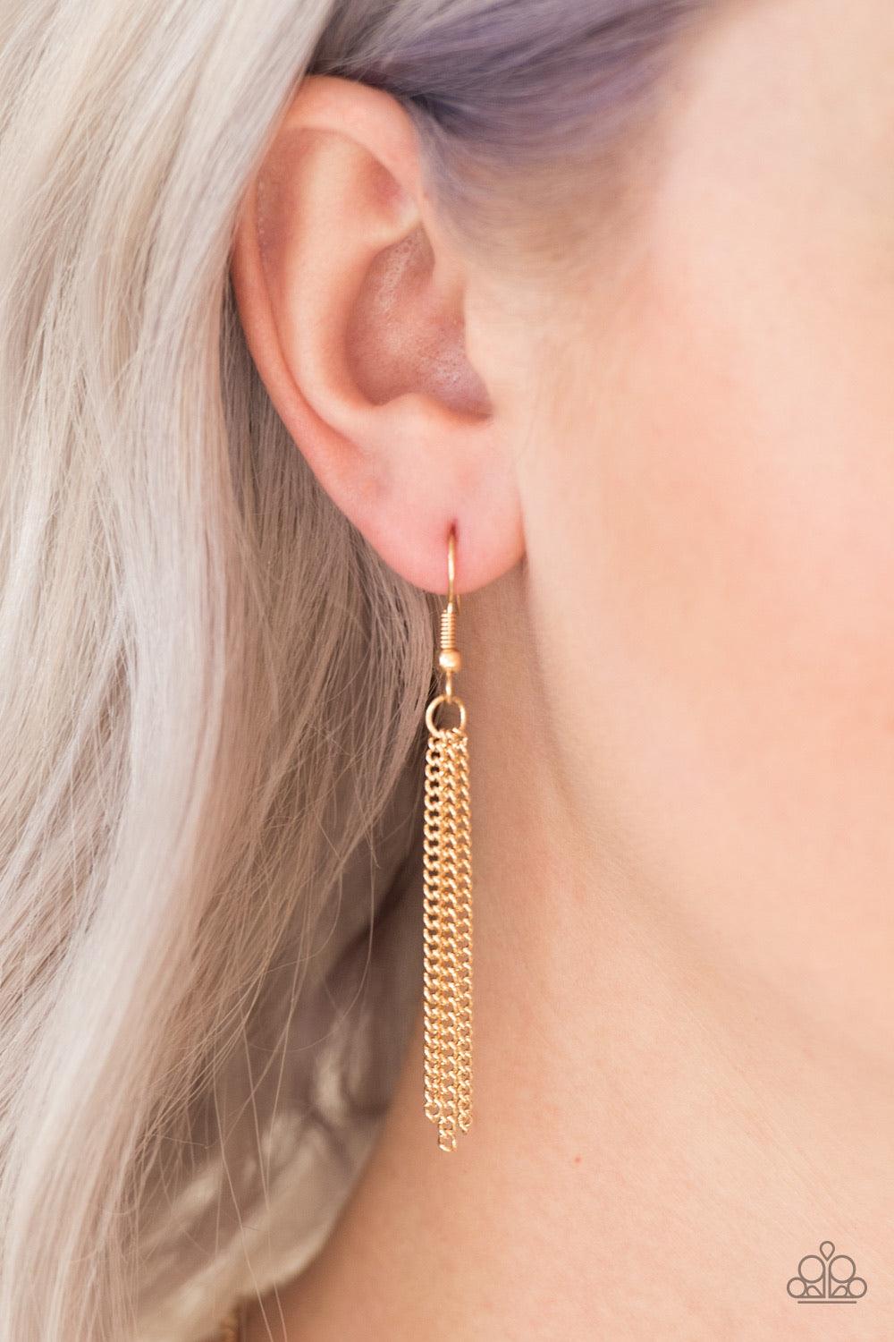 Paparazzi Accessories Zoo Zone - Gold Brushed in an antiqued finish, glistening gold chains stream from the bottom of a gold crescent, creating a bold fringe below the collar for a fierce look. Features an adjustable clasp closure. Sold as one individual