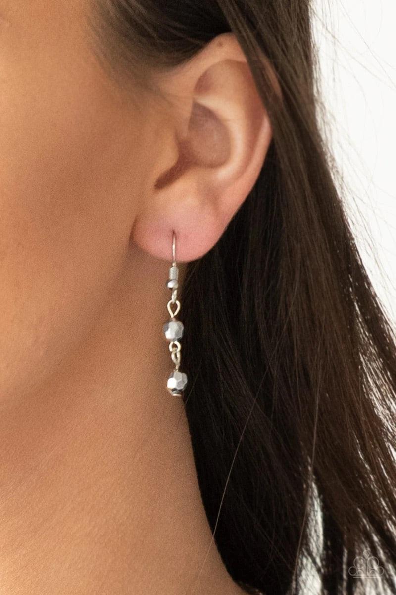 Paparazzi Accessories Rebel Remix - Silver Stands of faceted silver beads and glistening silver chains stream from a matching silver chain, creating an edgy fringe below the collar. Features an adjustable clasp closure. Sold as one individual necklace. In