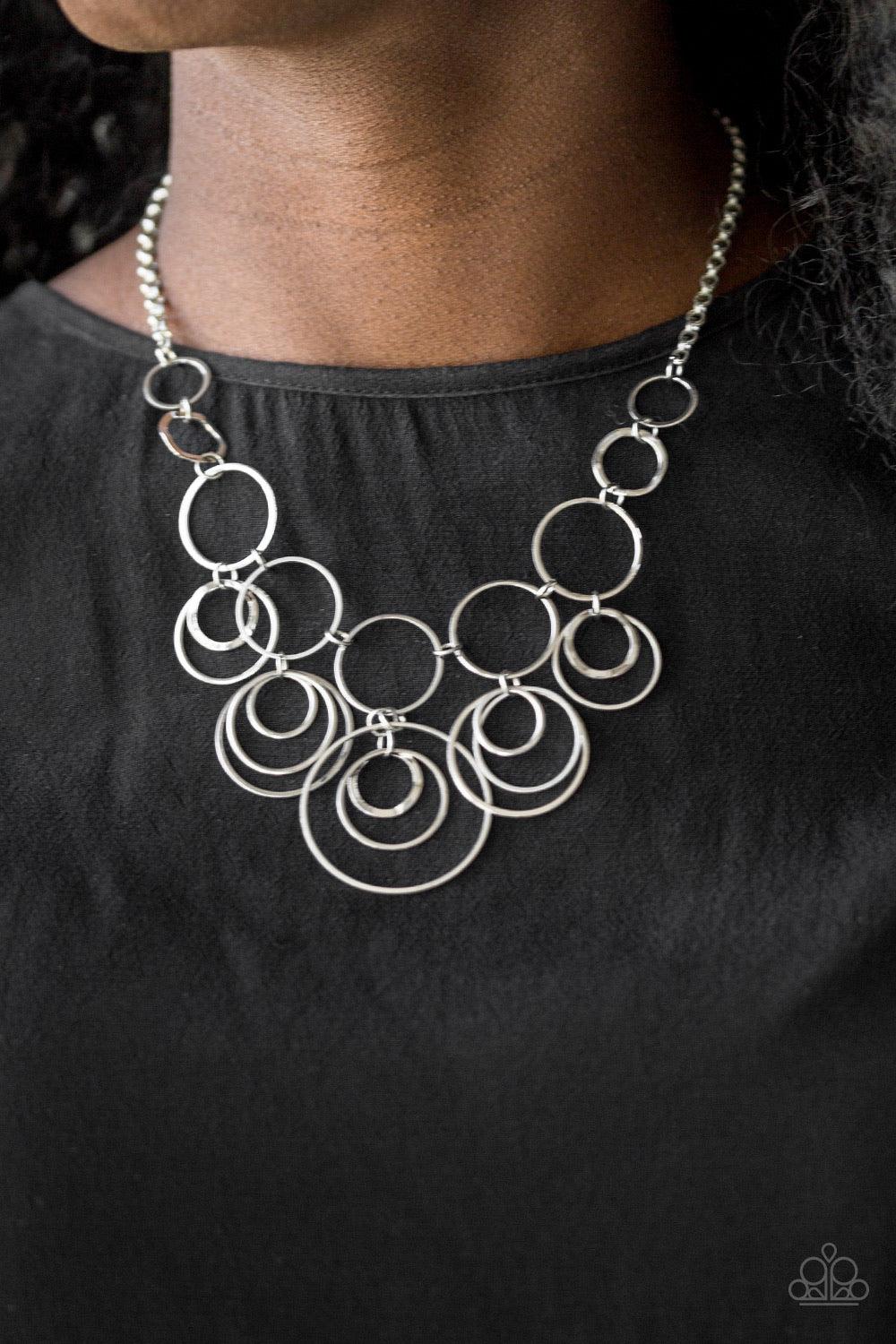 Paparazzi Accessories Break The Cycle - Silver Featuring smooth and delicately hammered finishes, mismatched silver hoops connect below the collar for a bold industrial look. Features an adjustable clasp closure. Jewelry