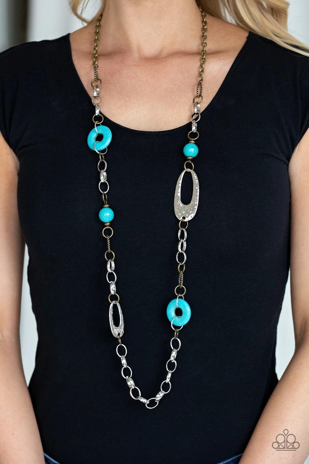Paparazzi Accessories Artisan Artifact - Multi A compilation of refreshing turquoise stone beads, silver rings, brass rings, and hammered silver accents connect across the chest for an artisan flair. Features an adjustable clasp closure. Sold as one indiv