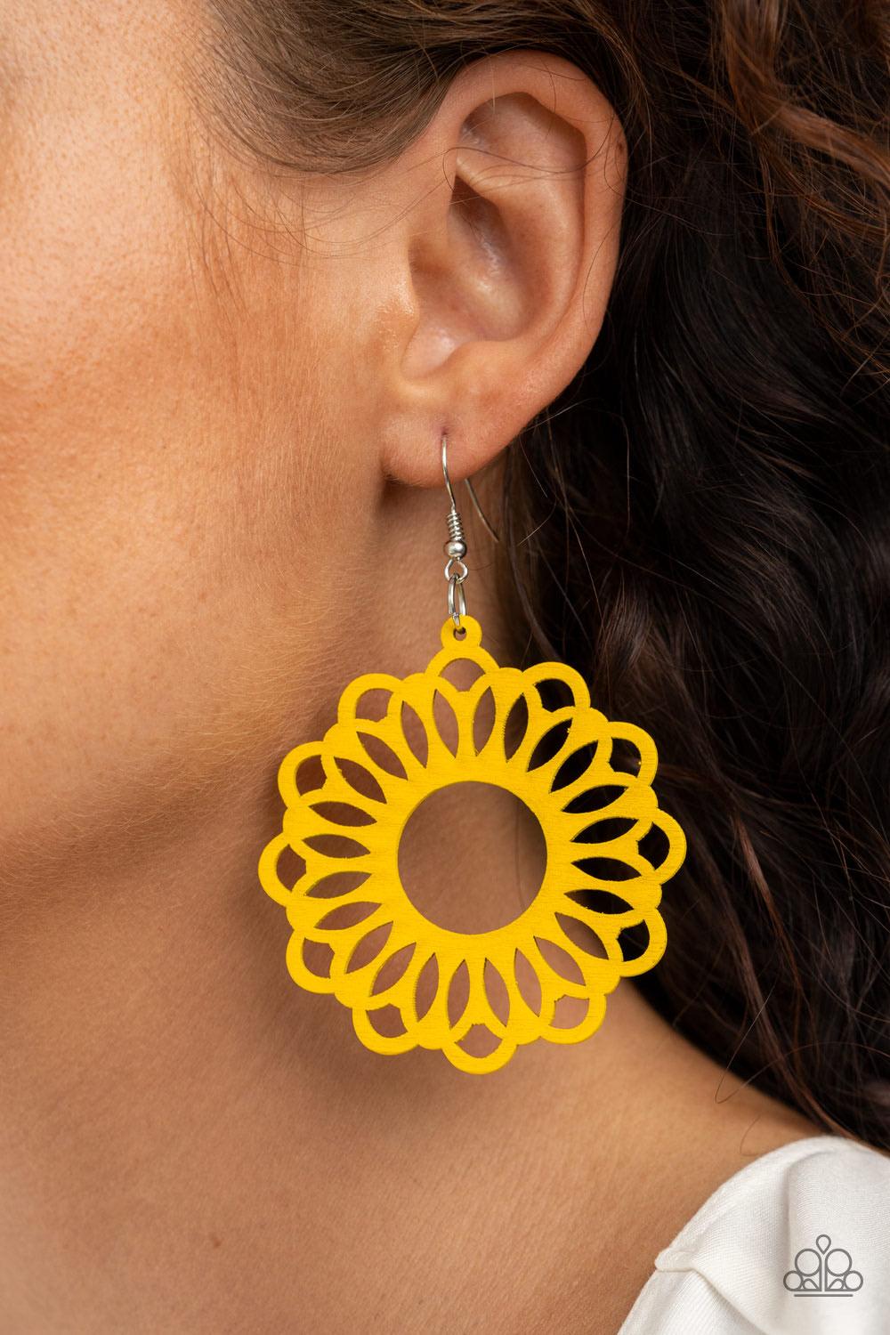 Paparazzi Accessories Dominican Daisy - Yellow Painted in a sunny yellow finish, an airy wooden frame is cut into a whimsical stenciled pattern for a colorful floral look. Earring attaches to a standard fishhook fitting. Sold as one pair of earrings. Jewe