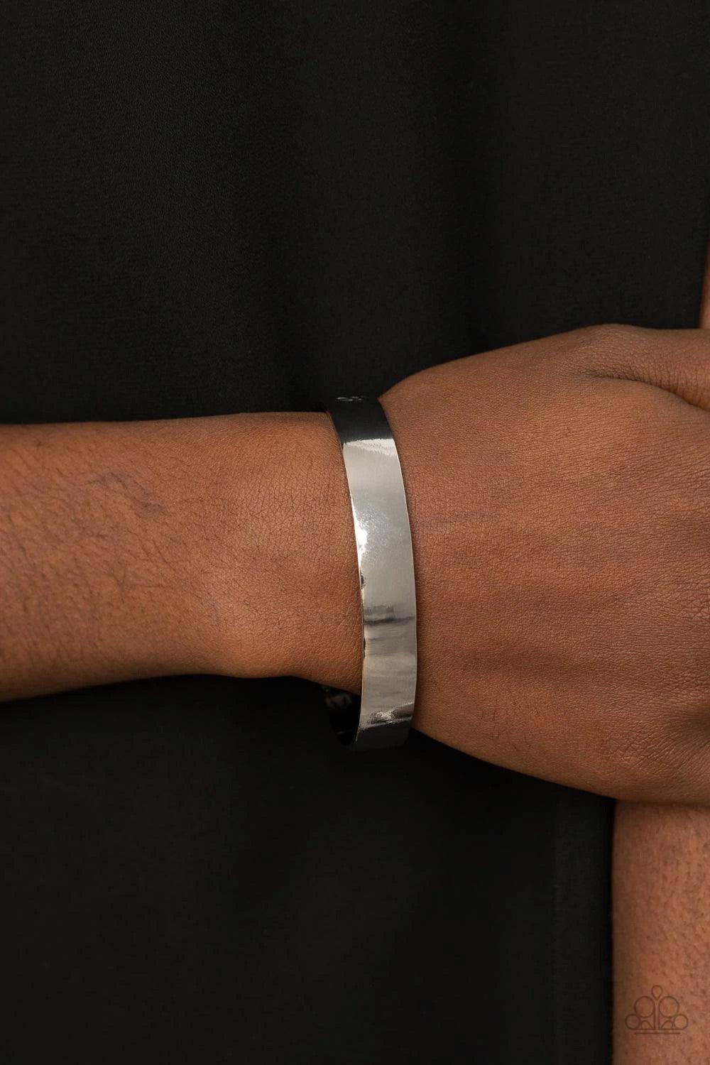 Paparazzi Accessories Fond Fable - Silver The ends of a dainty silver cuff are cutout and embossed in leafy filigree, creating a simple seasonal centerpiece around the wrist. Jewelry