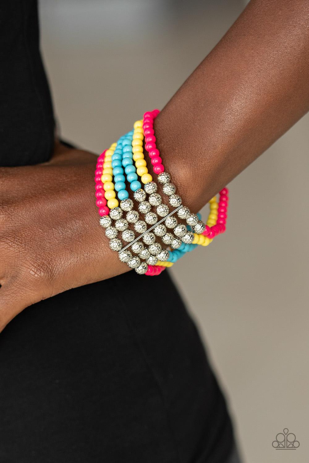 Paparazzi Accessories LAYER It On Thick ~Multi Held together with silver fittings, row after row of ornate silver and polished pink, yellow, and blue beads are threaded along stretchy bands around the wrist for a colorful fashion.