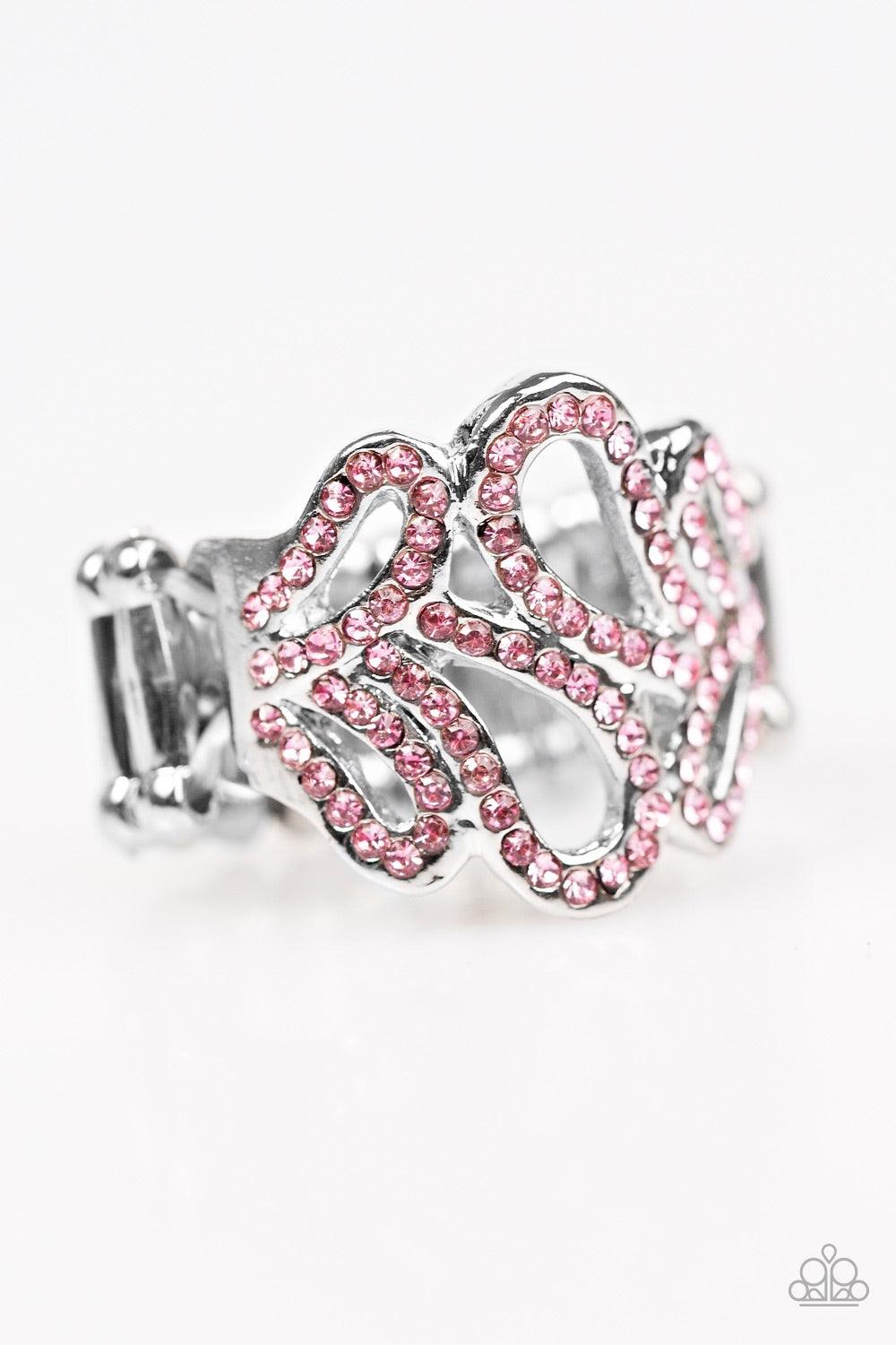 Paparazzi Accessories Dress Ir Up - Pink Ribbons of silver loop across the finger, creating a wavy band. Glittery pink rhinestones are sprinkled along swooping bands for a timeless finish. Features a stretchy band for flexible fit. Jewelry