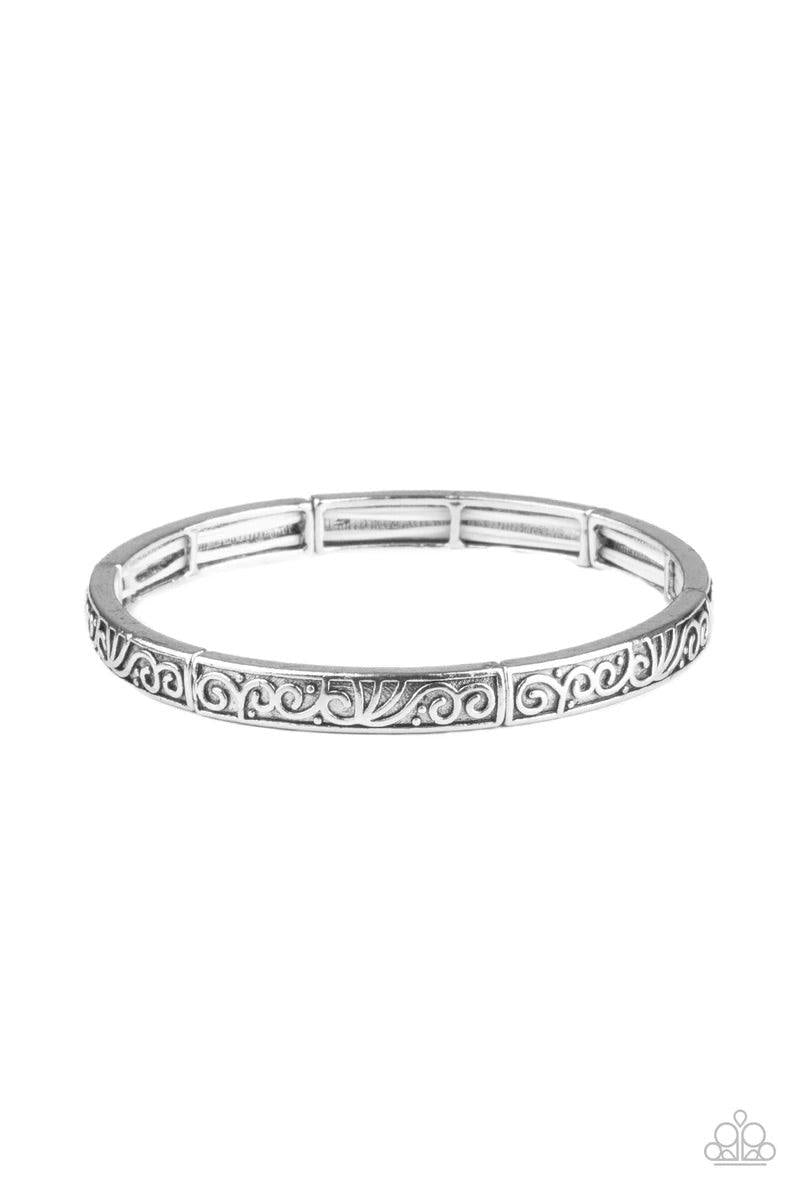 Paparazzi Accessories Precisely Petite - Silver Antiqued silver filigree vines across the front of dainty silver frames that are threaded along stretchy bands around the wrist for a seasonal look. Sold as one individual bracelet. Jewelry
