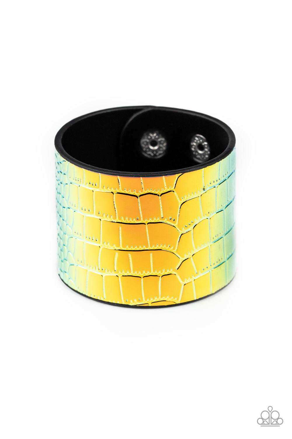 Paparazzi Accessories Chroma Croc - Multi Featuring a rainbow chrome-like finish, a croc patterned leather band curls around the wrist for a statement-making look. Features an adjustable snap closure. Jewelry