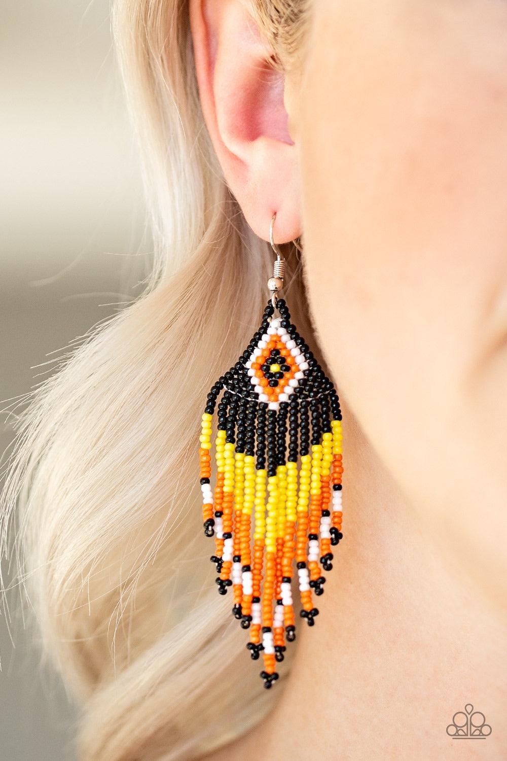 Paparazzi Accessories Wind Blown Wonderer - Yellow Strands of black, orange, white, and yellow seed beads cascade from the bottom of a southwestern beaded pattern, creating a vivacious beaded fringe. Earring attaches to a standard fishhook fitting. Jewelr
