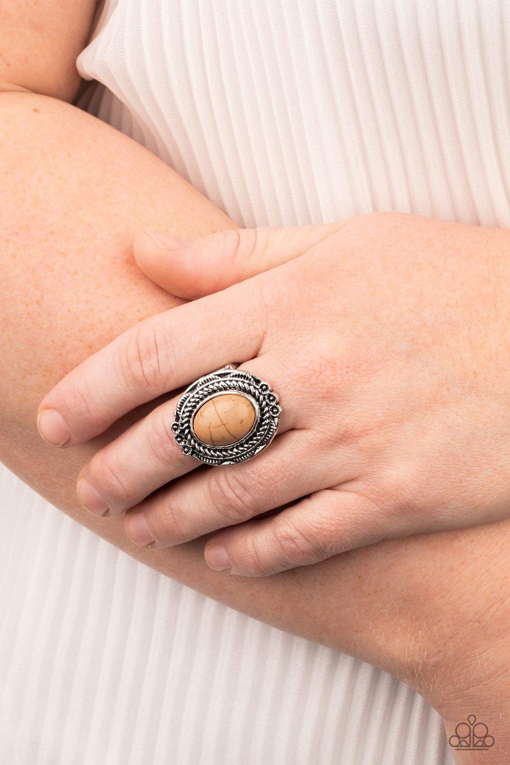 Paparazzi Accessories Tumblin’ Tumbleweeds - Brown A warm brown stone is pressed into an antiqued silver frame radiating with floral detail for a seasonal look. Features a stretchy band for a flexible fit. Sold as one individual ring. Jewelry