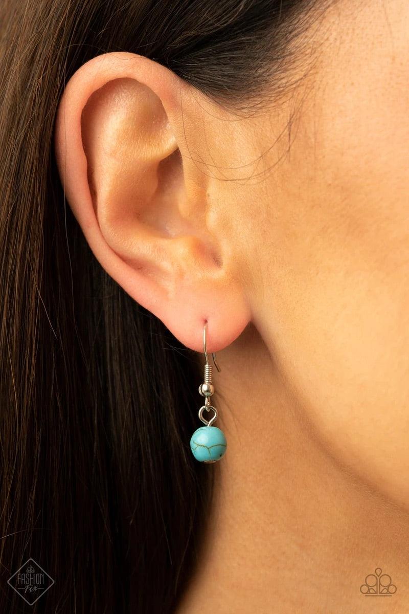 Paparazzi Accessories Geographically Gorgeous - Blue A large turquoise stone encased in a studded silver frame is swings dramatically from a heavy silver chain with oversized links. A collection of turquoise stones wraps around the bottom of the large pen
