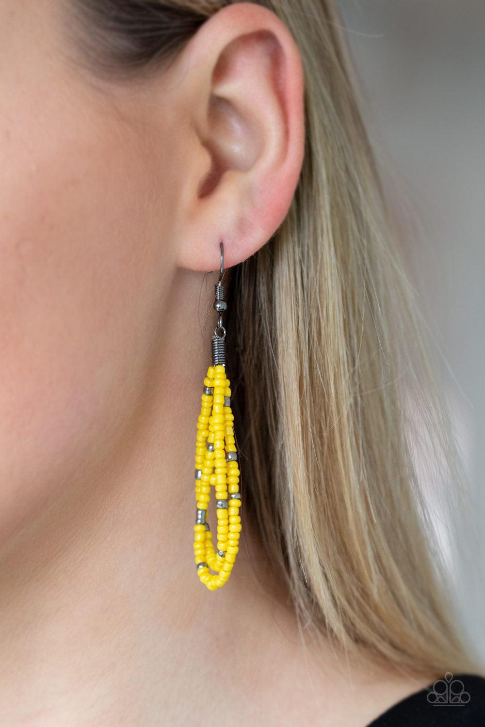 Paparazzi Accessories Rio Rainforest - Yellow Suspended between two gunmetal fittings, row after row of countless strands of yellow seed beads layer below the collar. Dainty gunmetal seed beads are sprinkled across the strands for a seasonal finish. Featu
