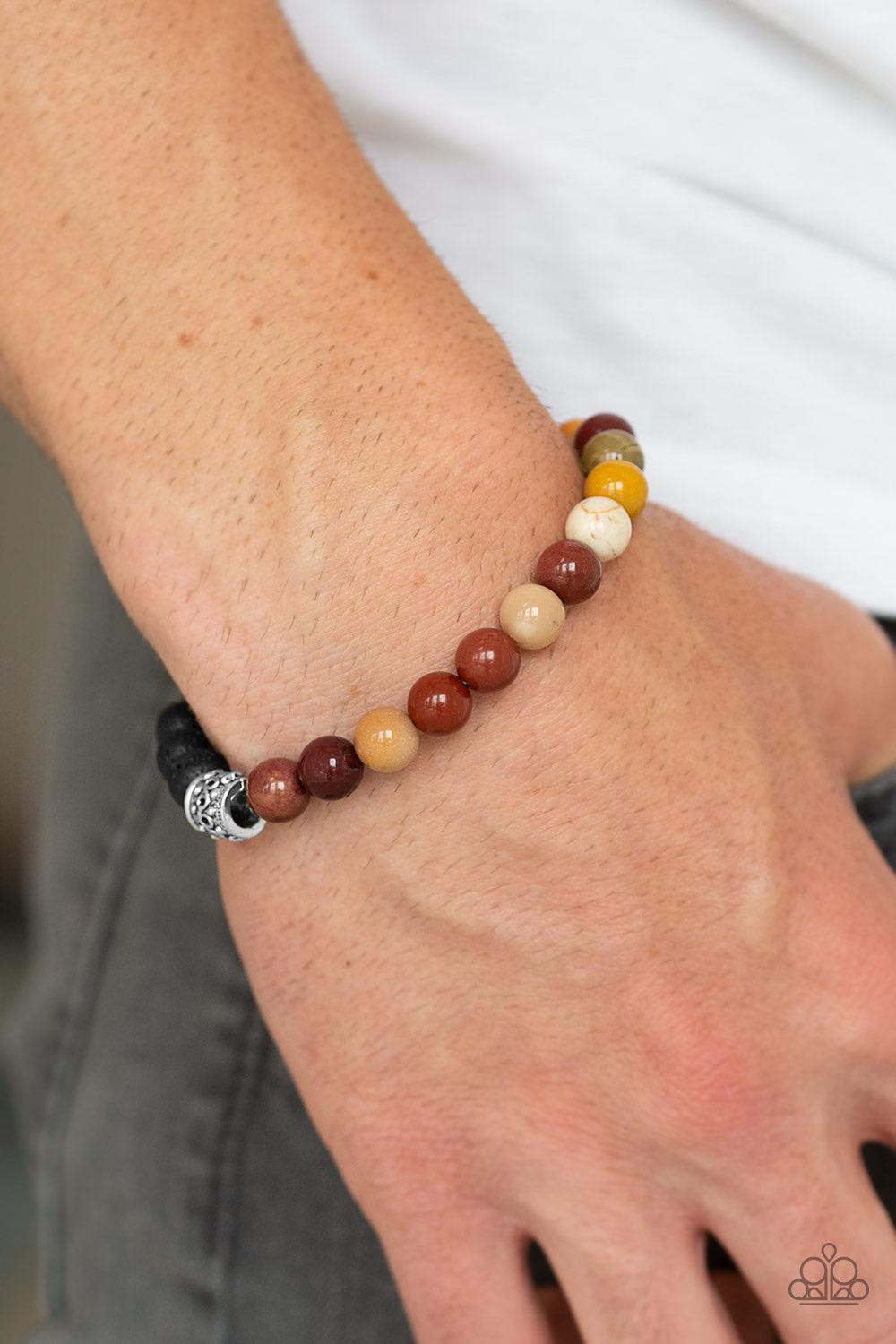 Paparazzi Accessories Take it Easy - Yellow Infused with dainty silver accents, a collection of black lava rock beads and refreshing stone beads are threaded along a stretchy band around the wrist for a seasonal style. Jewelry