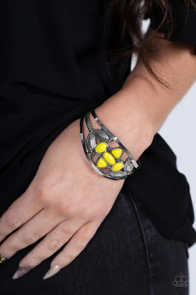 Paparazzi Accessories Caribbean Cabana - Yellow A shapely assortment of Illuminating acrylic beads adorn the center of a layered silver cuff adorned in leafy silver texture, creating a vivacious pop of color around the wrist. Sold as one individual bracel