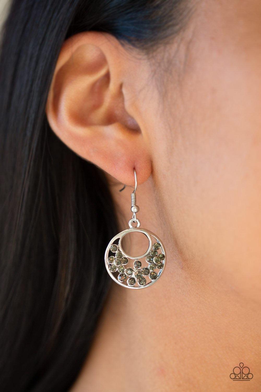Paparazzi Accessories Sugary Shine - Silver Smoky rhinestones are sprinkled across the center of an airy silver hoop for a whimsical look. Earring attaches to a standard fishhook fitting. Jewelry