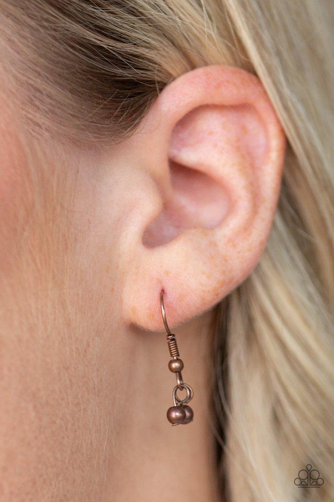 Paparazzi Accessories Keep Your Eye On The Pendulum - Copper Two mismatched copper chains layer down the chest. Dainty copper beads dangle from the bottom of the uppermost chain, while a rectangular pendulum-like pendant swings from the lowermost chain fo
