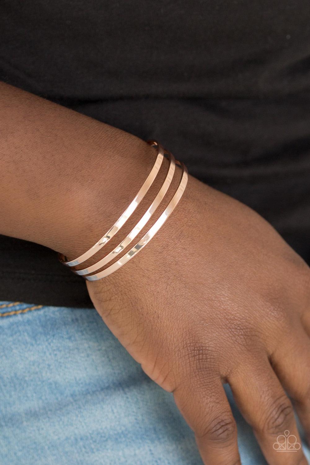 Paparazzi Accessories Street Sleek - Rose Gold Flat rose gold bars race across the wrist, coalescing into a sleek cuff for a casual look. Jewelry