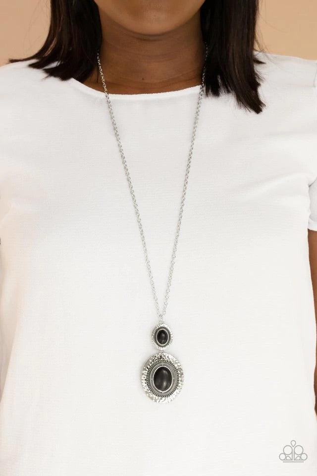 Paparazzi Accessories Southern Opera - Black A pair of oval black stones are pressed into the centers of studded and hammered silver fittings, creating a whimsically stacked pendant at the bottom of a lengthened silver chain. Features an adjustable clasp