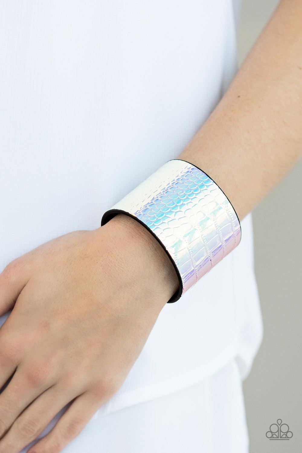 Paparazzi Accessories Chroma Croc - Multi Featuring a rainbow chrome-like finish, a croc patterned leather band curls around the wrist for a statement-making look. Features an adjustable snap closure. Jewelry