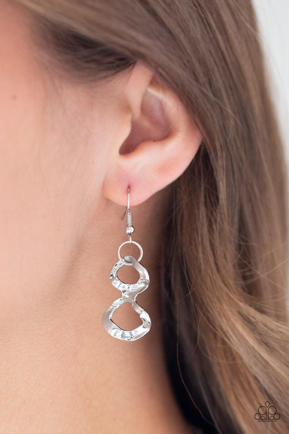 Paparazzi Accessories Street Meet And Greet ~Silver Asymmetrical silver frames connect below the collar, creating a bold web-like fringe for a statement-making look. Features an adjustable clasp closure. Jewelry