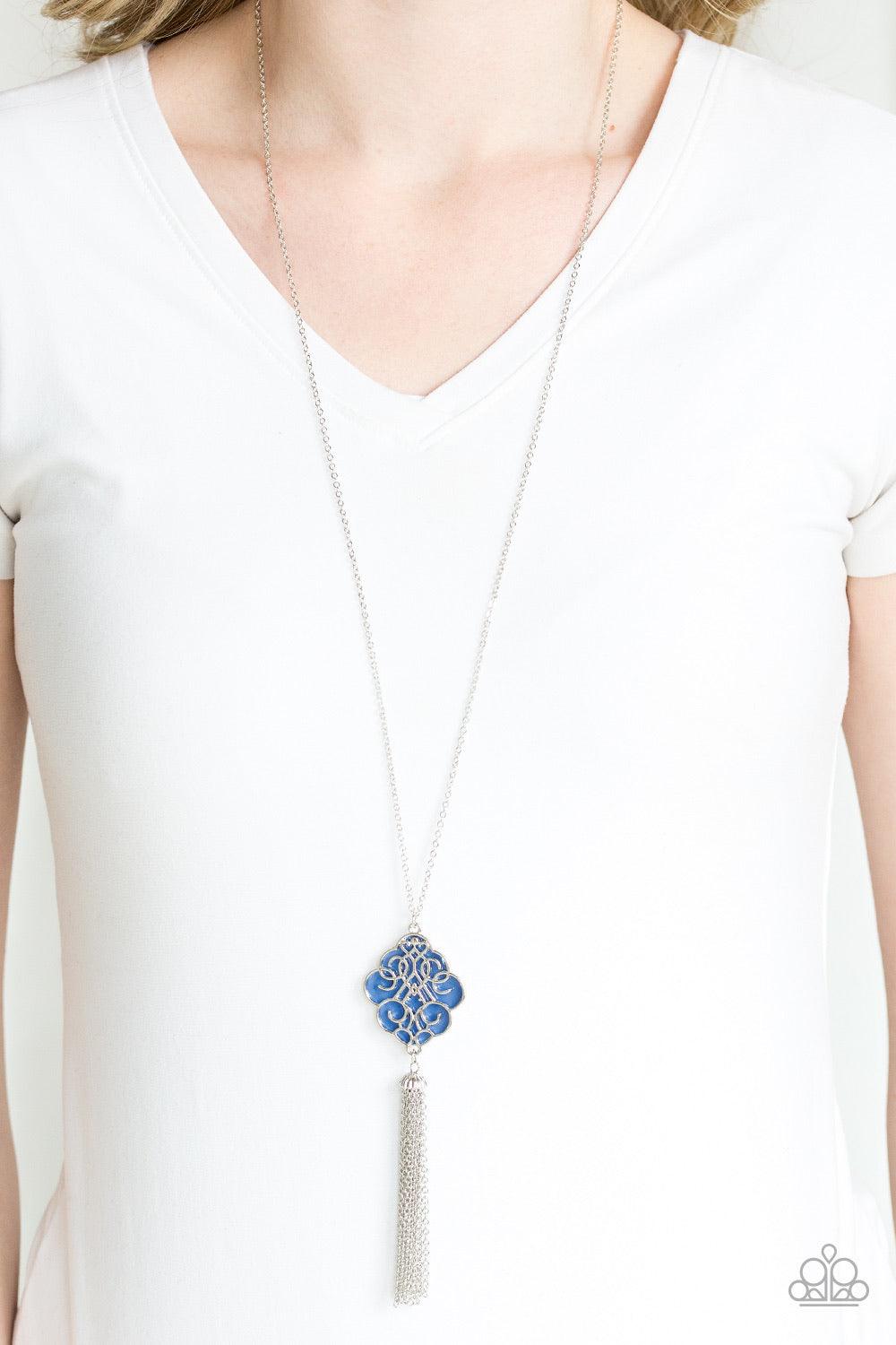 Paparazzi Accessories Malibu Mandala - Blue Shimmery silver filigree swirls across a shiny blue backdrop, coalescing into a colorful pendant. A glistening silver chain tassel swings from the bottom of the pendant for a whimsical finish. Features an adjust