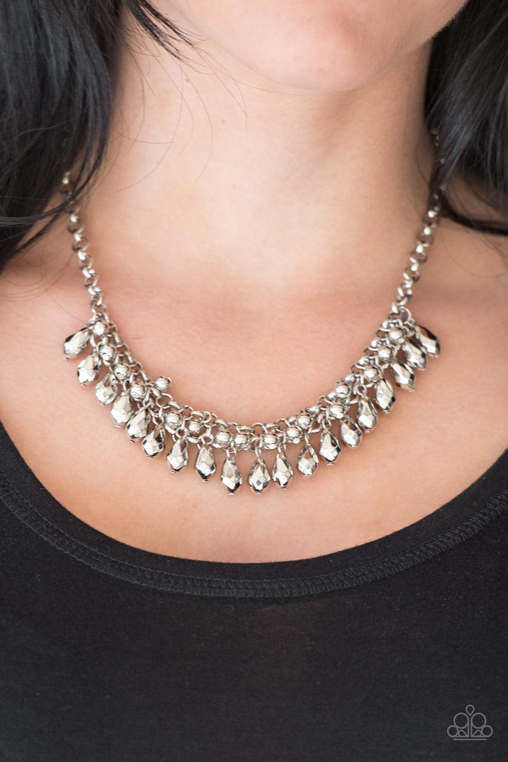 Paparazzi Accessories Prima Diva - Silver Classic silver and faceted silver beads cascade from interlocking silver chains, creating a fierce fringe below the collar. Features an adjustable clasp closure. Sold as one individual necklace. Includes one pair