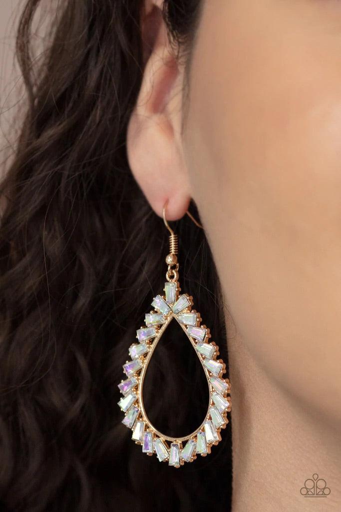 Paparazzi Accessories Stay Sharp - Gold Featuring flared emerald style cuts, a glittery collection of iridescent gems adorn the front of a gold teardrop for a jaw-dropping dazzle. Earring attaches to a standard fishhook fitting. Sold as one pair of earrin