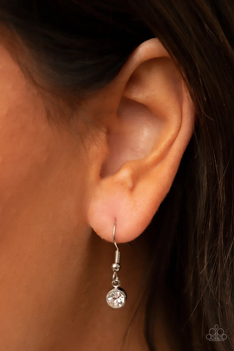 Paparazzi Accessories Happily Ever Ethereal - Red Attached to silver prongs, glassy white rhinestones radiate out from a red cat's eye stone at the bottom of a dainty silver chain. A curtain of shimmery silver chains streams from the bottom of the etherea