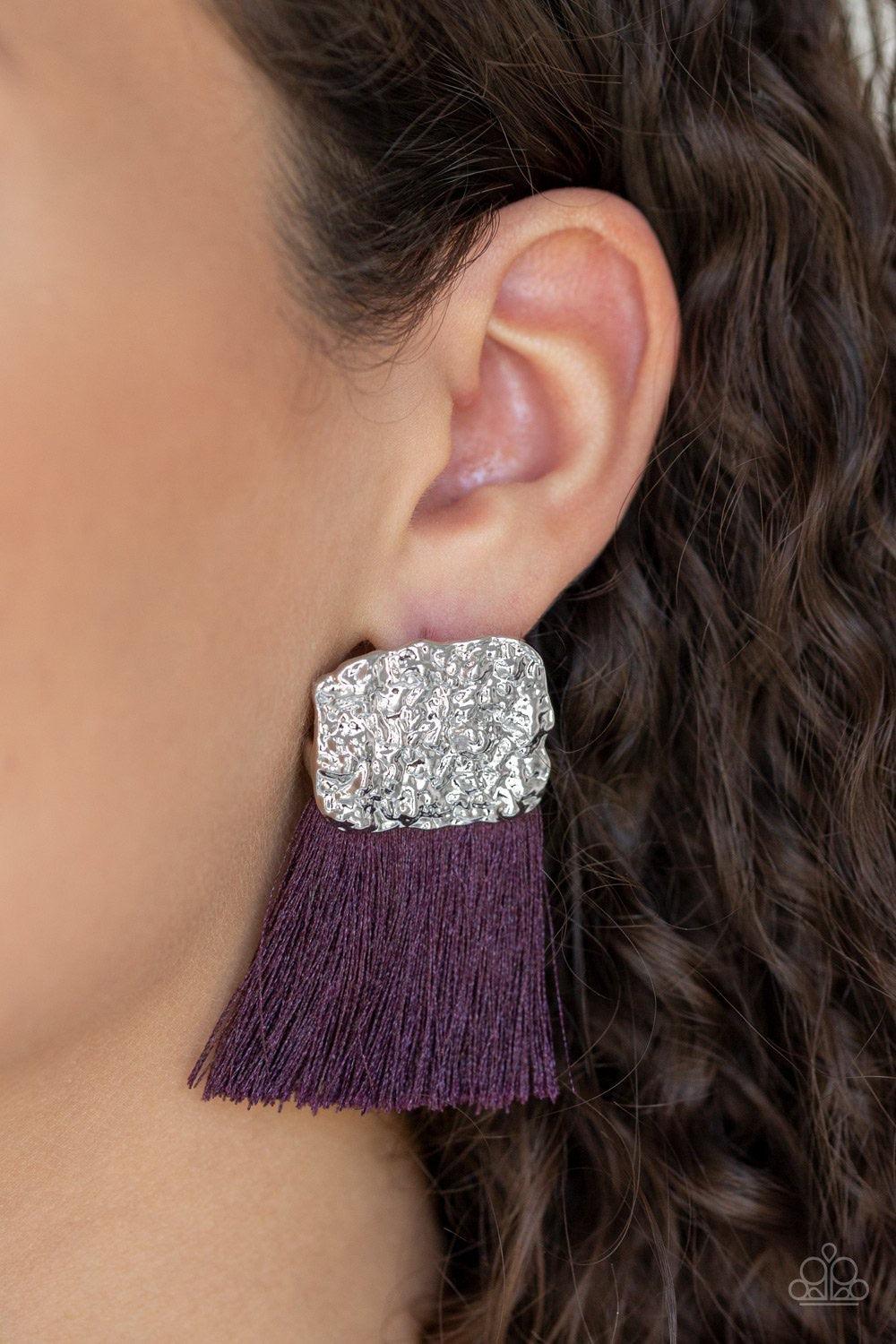 Paparazzi Accessories Plume Bloom - Purple A plume of shiny purple thread streams from the bottom of a hammered silver frame, creating a bold tasseled look. Earring attaches to a standard post fitting. Jewelry