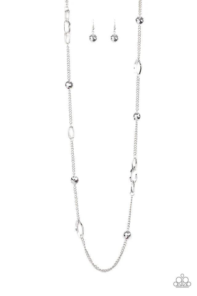 Paparazzi Accessories Duchess Dazzle - Silver A collection of hematite rhinestone gems and abstract silver rings trickle along a classic silver chain across the chest for a refined flair. Features an adjustable clasp closure. Sold as one individual neckla
