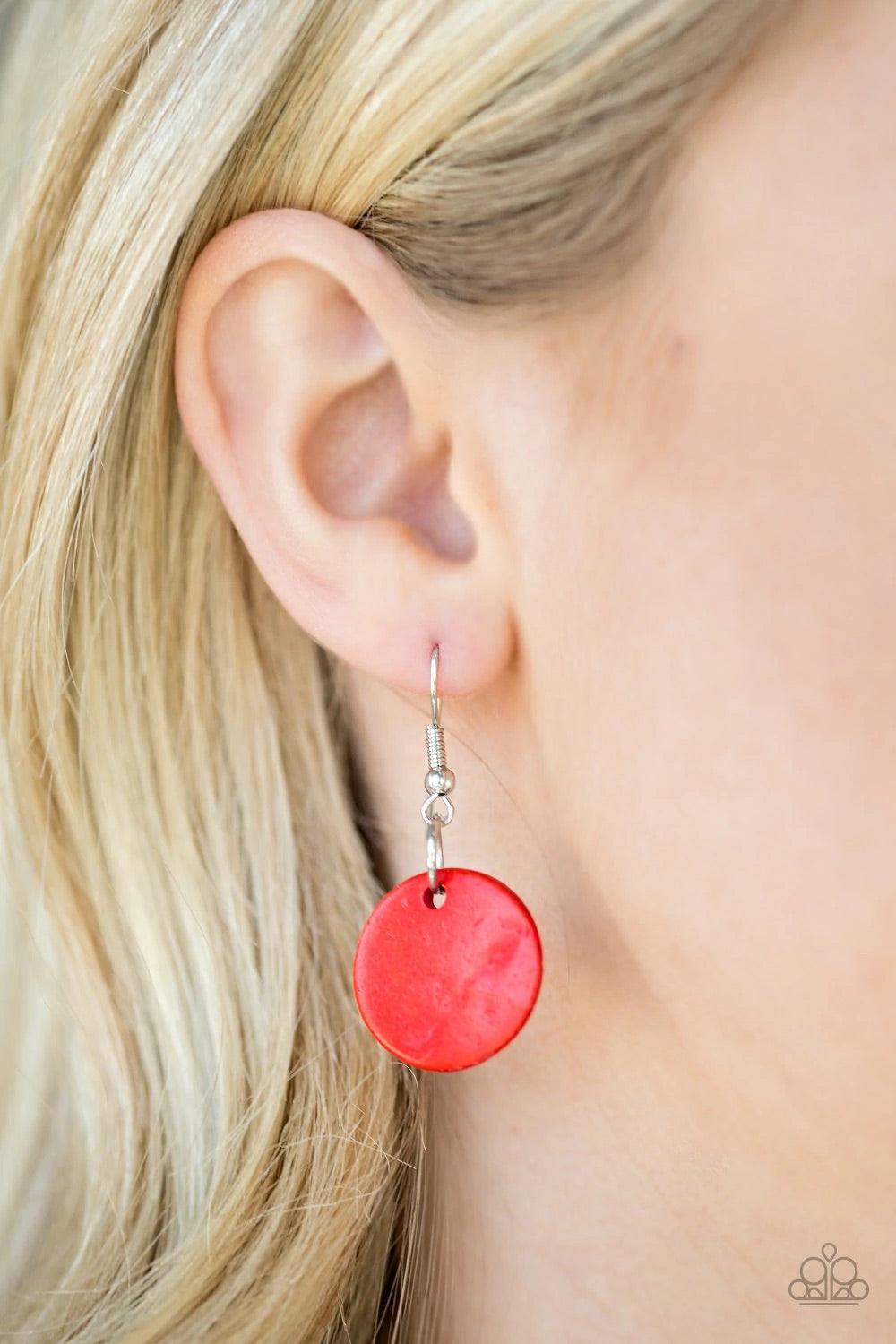 Paparazzi Accessories Pacific Paradise - Red Featuring abstract geometric finishes, mismatched brown wooden beads and fiery red accents are threaded along shiny brown cording. A dramatic geometric bead adorns the center, creating a bold summery look below