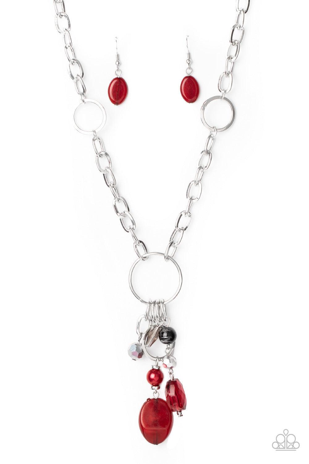 Paparazzi Accessories Lay Down Your CHARMS - Red A glittery compilation of faceted, smooth, and pearly red, black, and silver beaded charms swing from the bottom of a silver ring that attaches to a chunky silver chain below the collar for a colorfully cha