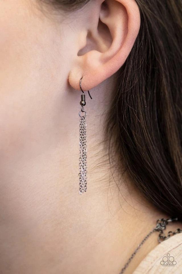 Paparazzi Accessories Shapely Silhouettes - Black Strand after strand of metallic gold and silver seed beads fall together to create a bold statement piece. Features an adjustable clasp closure. Sold as one individual necklace. Includes one pair of matchi