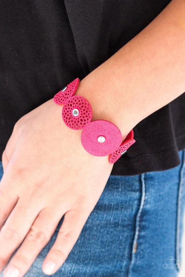 Paparazzi Accessories Poppin’ Popstar - Pink Dotted with white rhinestone centers, round pink suede frames join across the wrist for a whimsical look. Features an adjustable snap closure. Sold as one individual bracelet. Jewelry