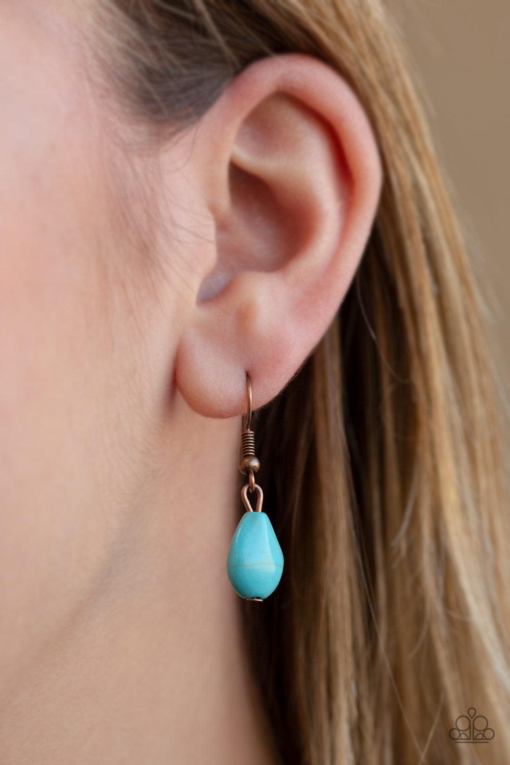 Paparazzi Accessories BADLAND To The Bone - Copper A dramatic turquoise stone teardrop is pressed into a glistening copper frame radiating with rustic patterns. The impressive pendant swings from the bottom of a lengthened copper chain for a seasonal look