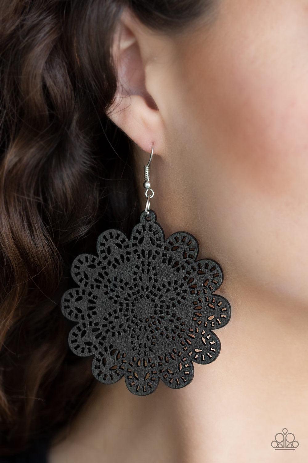 Paparazzi Accessories Coachella Cabaret - Black Brushed in a shiny black finish, a wooden floral frame swings from the ear in a whimsical fashion. Earring attaches to a standard fishhook fitting. Jewelry