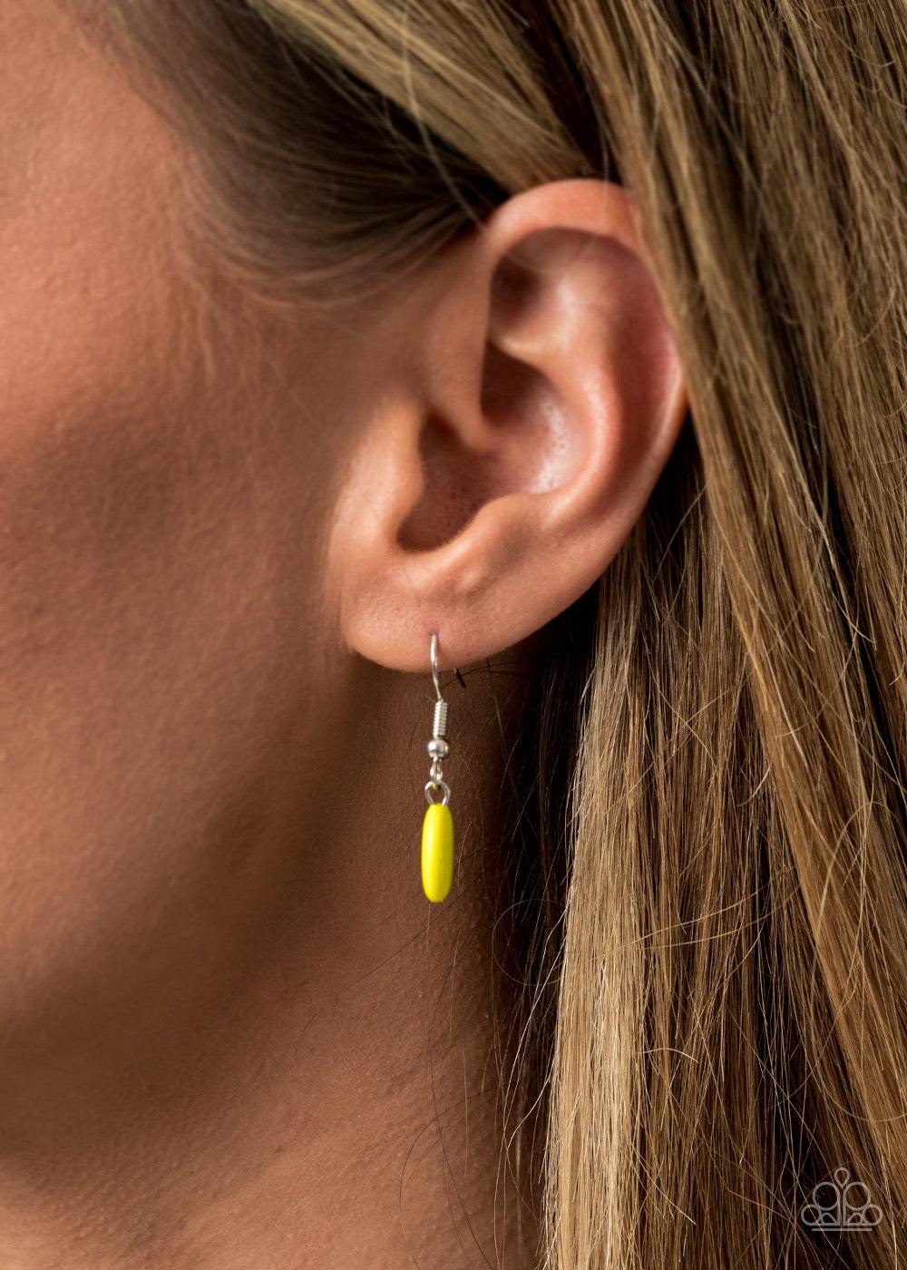 Paparazzi Accessories Law of the Jungle - Yellow Sectioned off by edgy silver fittings, a flamboyant collection of rebellious Green Sheen beads link into two colorful layers below the collar for a bold pop of color. Features an adjustable clasp closure. J