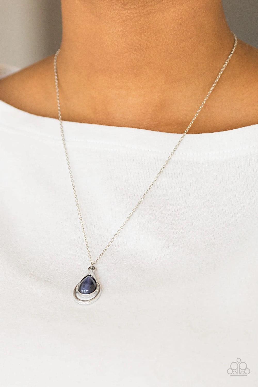 Paparazzi Accessories Just Drop It! - Blue Chiseled into a tranquil teardrop, a glowing blue moonstone is pressed into an abstract silver frame, creating a whimsical pendant. Features an adjustable clasp closure. Sold as one individual necklace. Includes