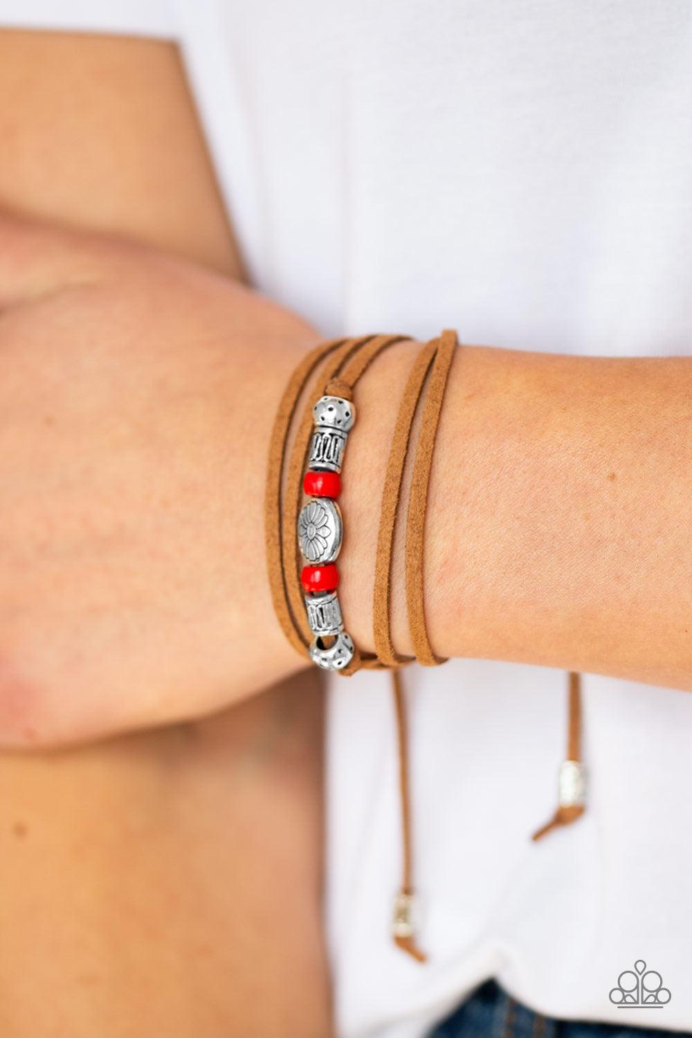 Paparazzi Accessories Clear A Path - Red An array of red and silver beads are knotted in place along elongated suede cording for a wanderlust fashion. To secure bracelet, tie ends in place around the wrist at desired length. Jewelry