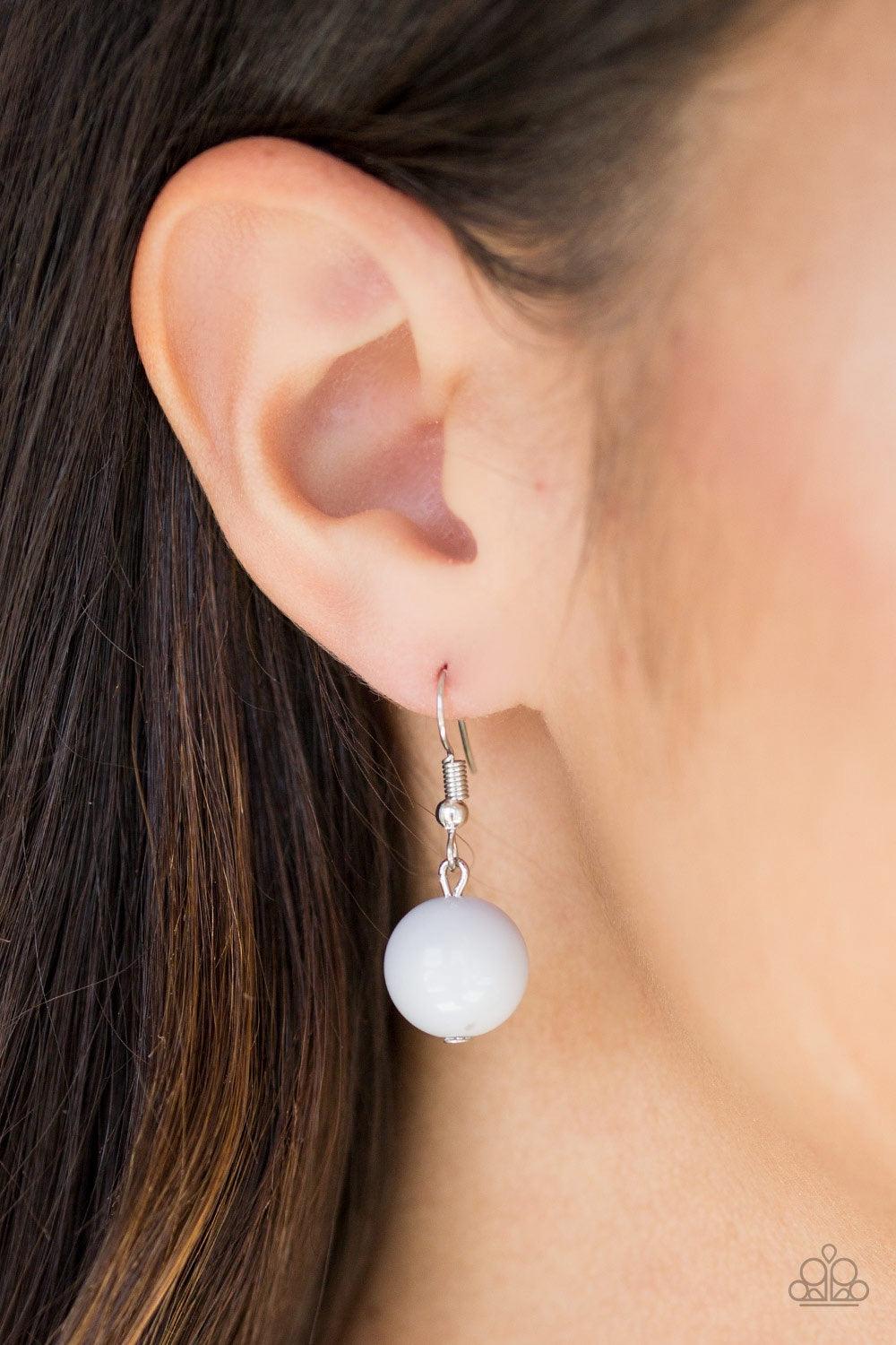 Paparazzi Accessories South Shore Sensation - Silver Dramatic silver, neutral gray, and faceted cloudy beads are threaded along an invisible wire below the collar for a seasonal look. Features an adjustable clasp closure. Jewelry