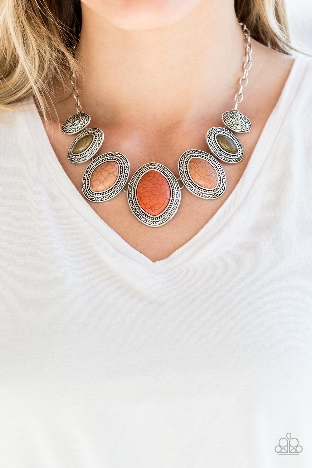 Paparazzi Accessories Sierra Serenity - Multi Gradually increasing in size near the center, earthy orange, green, and brown stones are pressed into textured silver frames below the collar for a tribal inspired look. Features an adjustable clasp closure. J