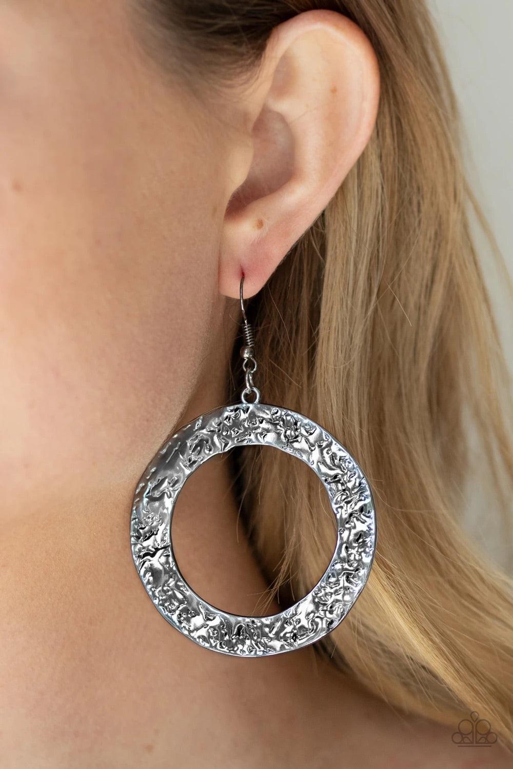 Paparazzi Accessories PRIMAL Meridian - Black A flat gunmetal circular frame has been hammered in blinding detail for a handcrafted look. Earring attaches to a standard fishhook fitting. Sold as one pair of earrings. Jewelry
