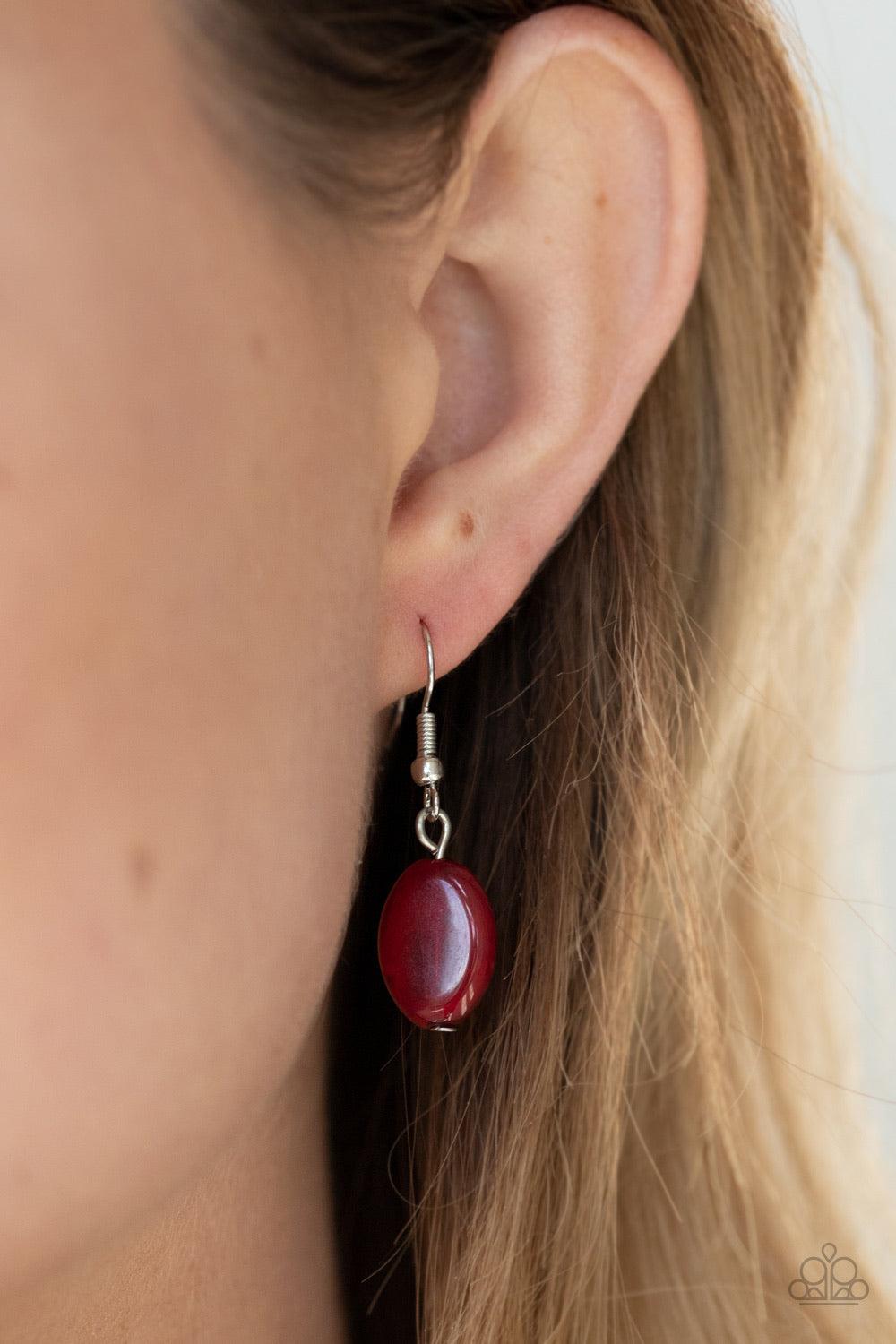 Paparazzi Accessories Lay Down Your CHARMS - Red A glittery compilation of faceted, smooth, and pearly red, black, and silver beaded charms swing from the bottom of a silver ring that attaches to a chunky silver chain below the collar for a colorfully cha