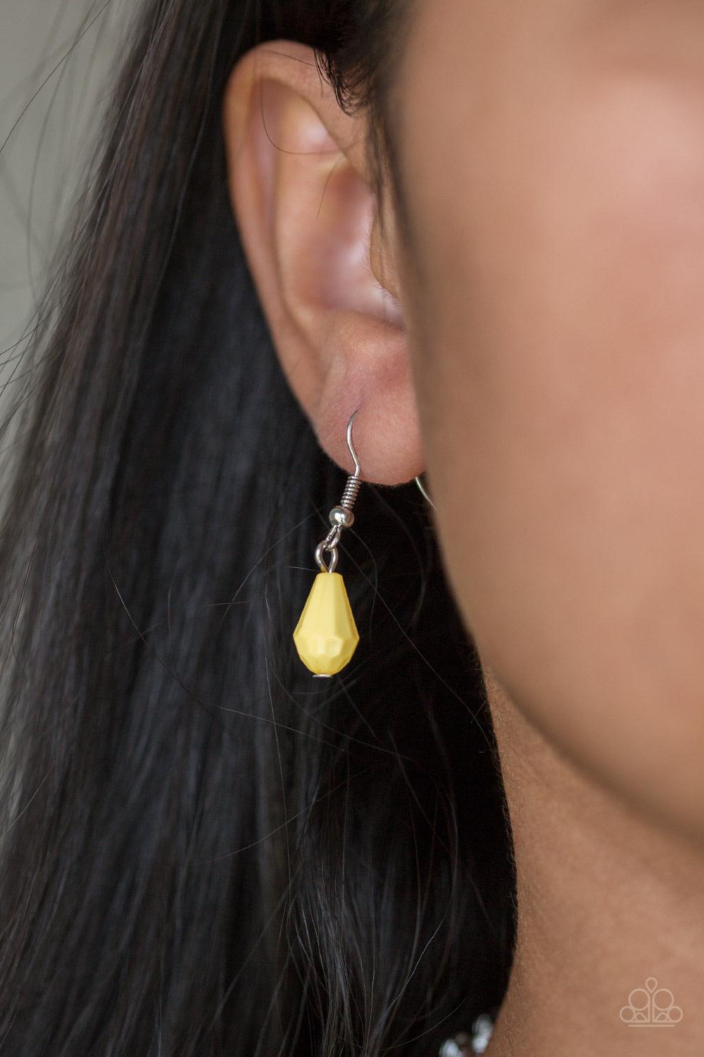Paparazzi Accessories Modern Macarena - Yellow Featuring round and teardrop shapes, clusters of faceted yellow beads swing from the bottom of a shimmery silver chain, creating a playful fringe below the collar. Features an adjustable clasp closure. Jewelr