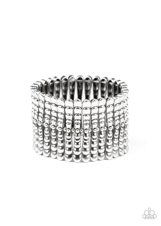Paparazzi Accessories Level Field - Silver Infused with dainty silver beads, rippling silver bars are threaded along stretchy bands around the wrist, creating a rustic centerpiece. Sold as one individual bracelet. Jewelry