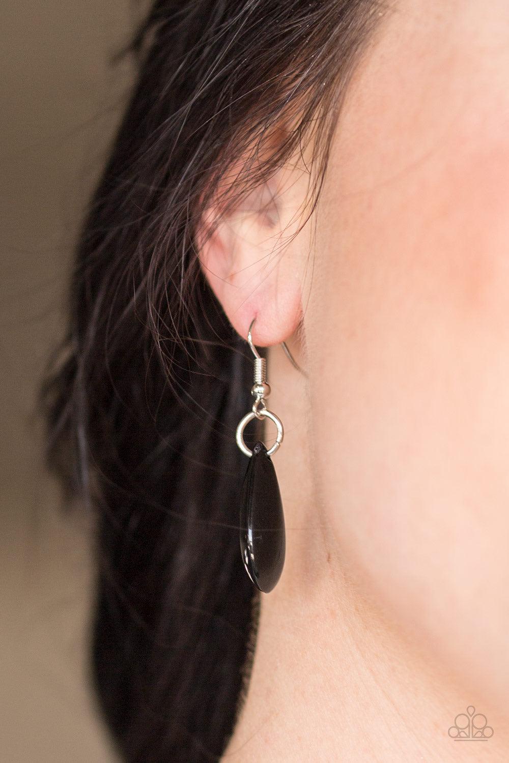 Paparazzi Accessories Tropical Storm ~Black Polished black teardrops drip from the bottom of a shimmery silver chain, creating a colorful fringe below the collar. Featuring a delicately hammered surface, dainty silver teardrops are sprinkled along the cha
