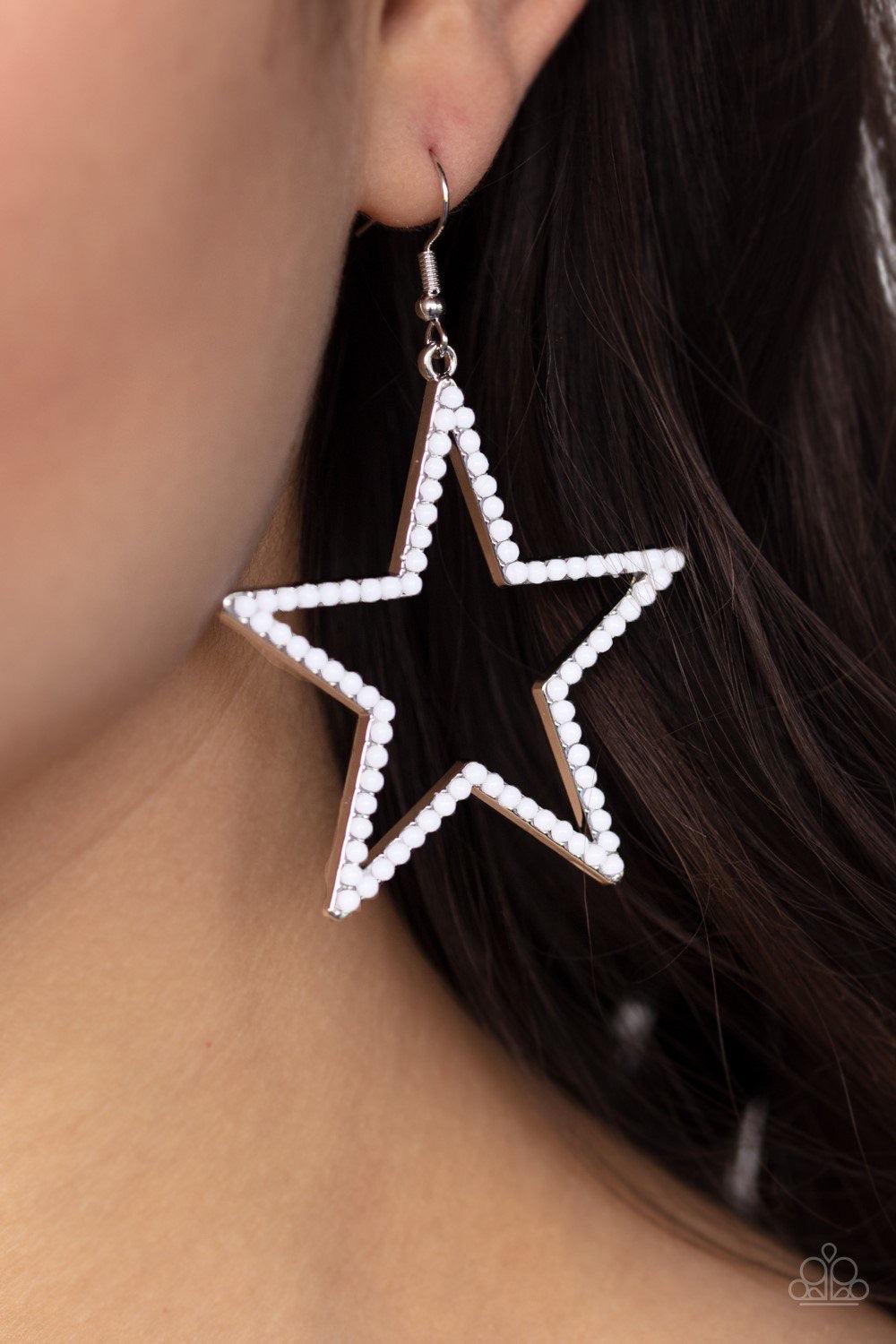 Paparazzi Accessories Count Your Stars - White Dotted in dainty white beads, an airy star frame swings from the ear for a patriotic style. Earring attaches to a standard fishhook fitting. Sold as one pair of earrings. Jewelry