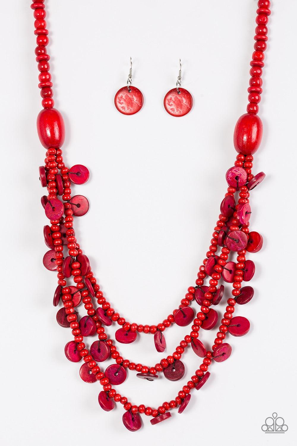Paparazzi Accessories Safari Samba - Red Brushed in a fiery red finish, two bold wooden beads give way to summery layers. Brushed in a distressed finish, dainty wooden discs swing from the bottom of the layers for a flirty finish. Jewelry