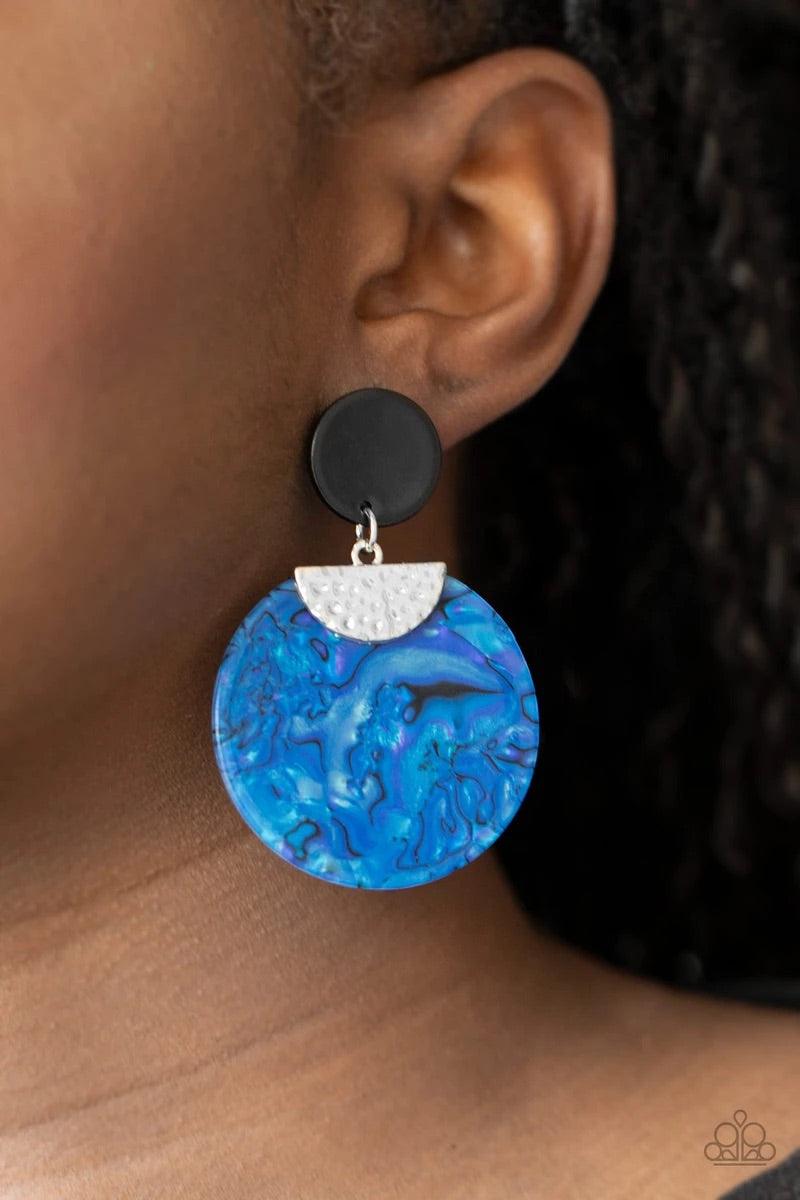 Paparazzi Accessories Really Retro-politan - Blue A hammered silver fitting pinches an iridescent acrylic circle swirling with dizzying blue accents. The colorful frame links to the bottom of a dainty black acrylic circle, coalescing into a retro lure. Ea