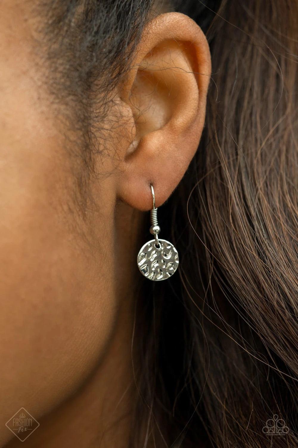 Paparazzi Accessories Spotlight Ready - Silver Rows of hammered silver discs trickle from the bottom of a dainty silver chain, creating an edgy tapered fringe that sways below the collar. Features an adjustable clasp closure. Sold as one individual neckla