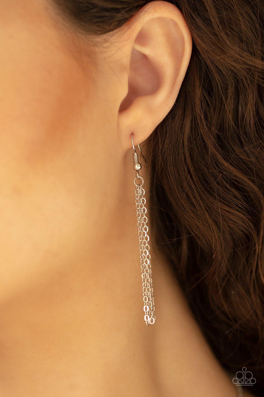 Paparazzi Accessories Heartbeat Bling - White A dainty heart-shaped white cubic zirconia swings below the collar for a timelessly romantic look. Features an adjustable clasp closure. Sold as one individual necklace. Includes one pair of matching earrings.